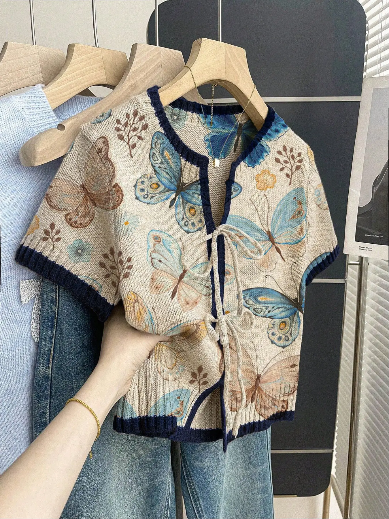 Women's khaki bohemian vacation short-sleeve knit top. Loose round neck, contrast butterfly print, front tie and contrast piping. Comfortable for spring & summer casual wear. Casual Boho Soft. Womenswear