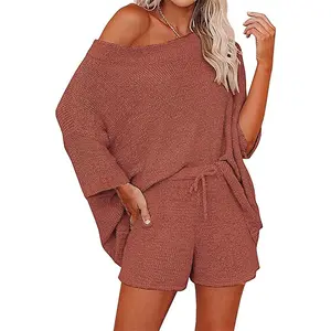 Relaxed rust-colored knit lounge set with an off-shoulder oversized top and matching drawstring shorts—cozy, chic, and effortlessly stylish-D240133