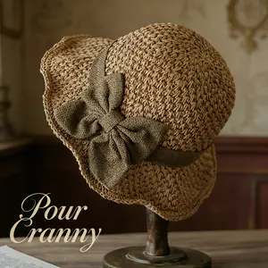 Versatile Vintage Hand-Woven Straw Hat—A foldable, elegant, and stylish French-style sun hat adorned with a ruffled bow. Offering sun protection, breathability, and comfort, it is the perfect choice for travel and beach outings.
