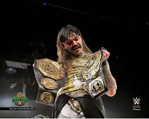 Dominik Mysterio WWE Unsigned AAA Worlds Collide Holding Both Titles Photograph