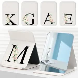 1pc Portable Folding Mirror - Folding Pocket Mirror with & Rubber Frame, Waterproof & Dustproof, Compact & Lightweight for Camping, Gym, Travel - Mirror with Black Lettering and Flower Print