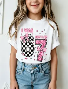 67 Shirt, 7 Year Old Girl Birthday Gift Shirt I Was Six Now Seven Retro Checkered Leopard Bow Graphic T-Shirt for Kids Birthday Party Supplies