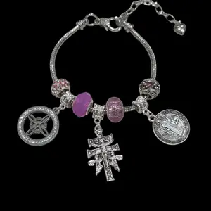 pink triple protection ad charms bracelet. nudo de bruja, Cruz de Caravaca, medalla de San Benito