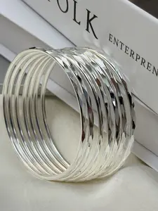 Women's 925 Sterling Silver Stackable Bracelet Set—featuring sparkling diamond-cut detailing and a minimalist textured wire design; a slender, high-polish fashion accessory perfect as a birthday gift.