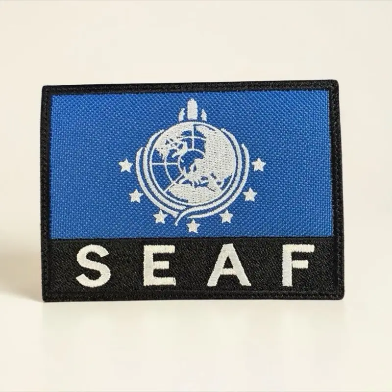 SEAF Helldivers 2 Official Logo Embroidered Iron-On Adhesive Applique Patch - 1 Count, 4x3 in Crisp Detail, Sew-Iron Hook Backs, Customizable for Helldivers Missions & Daily Life Fabric Craft Projects