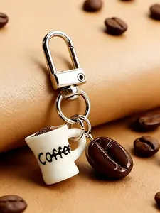 A keychain pendant, Coffee Charms Keychain, in the shape of a coffee cup and coffee beans, featuring playful and cute style. Suitable for coffee lovers to hang on their bags or keys, adding personality to leisure scenes such as commut