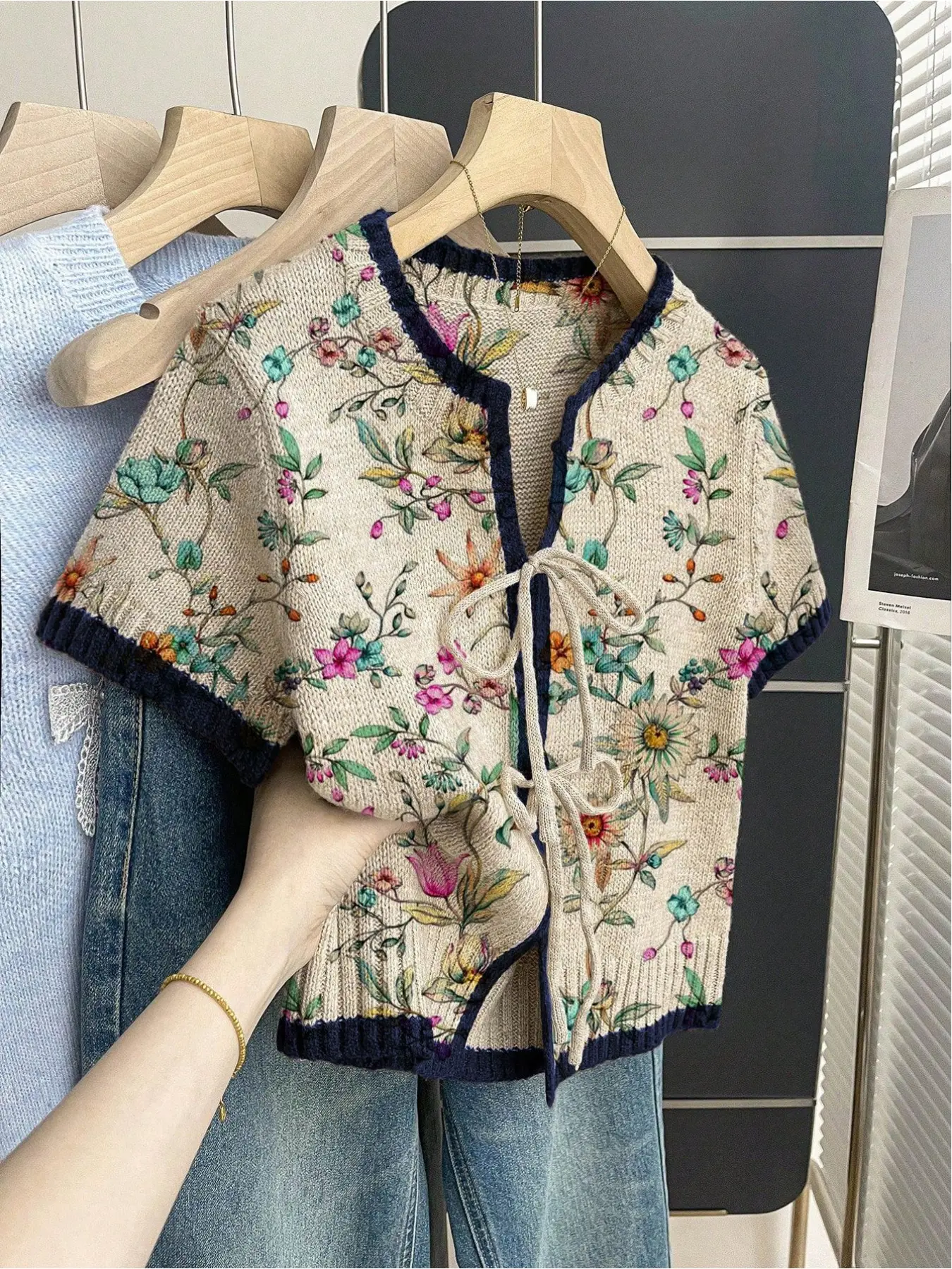 Women's khaki bohemian vacation short-sleeve knit top. Loose round neck, contrast all-over Floral print, front tie and contrast piping. Comfortable for spring & summer casual wear. Boho Tie Top Womenswear