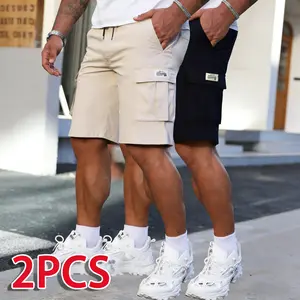 Two men’s cargo shorts with a street cool style. Side panels feature 3D cargo pockets that expand the usable space. A drawstring waist allows for easy adjustment of tightness. The smooth, structured fabric resists creasing, and the loose fit doesn’t cling