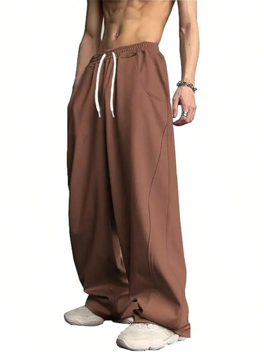 Spring/Autumn loose wide-leg casual men’s sweatpants with color-block design, drawstring elastic waistband, drapey straight cut; comfortable and breathable, slimming fit; American high-street style, floor-length casual pants; pockets are small.