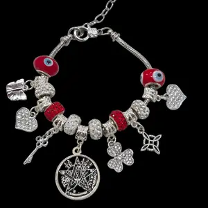 Red Ojo turco, with tetragramaton, witch knot, heart charms bracelet. You can add charms