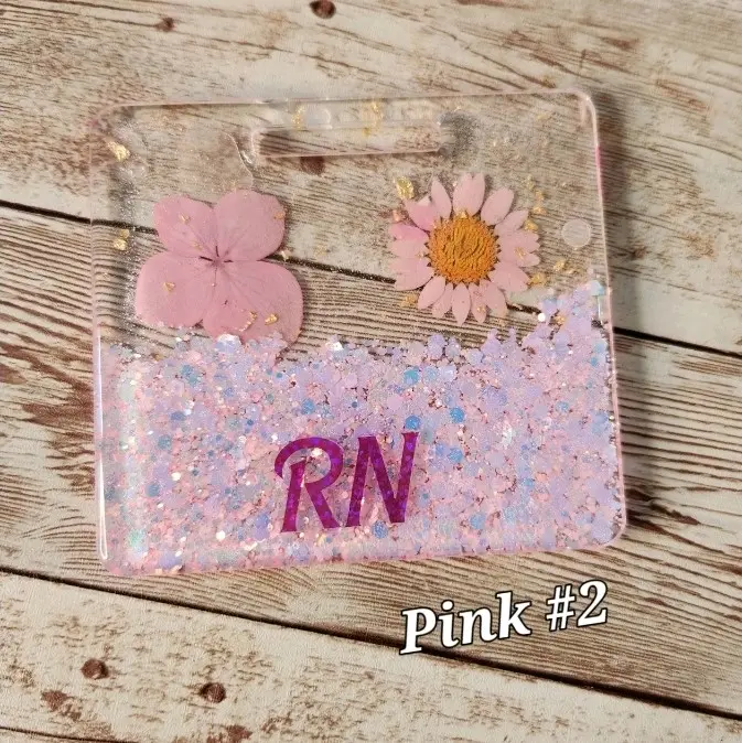 Personalized Glitter Pink Flowers Badge Buddy for Medical Professionals - Acrylic Blanks, Epoxy Resin, Vertical, Extended Horizontal & Horizontal Designs, Smooth Finish, Black & Gold Foil, Custom RN Title, Multiple Colors