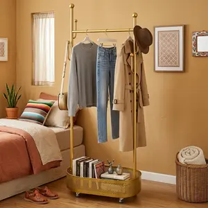 Gold Finish Mobile Clothes Rack with Bottom Storage Basket Space Saving Clothing Stand for Organized Storage in Modern Design