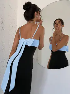 A spaghetti strap dress with a large color-block bow at the back and a side slit, Elegant, sensual, feminine, Lady style, known as the 'birthday dress' and 'date atmosphere dress', suitable for banquets, parties, casual social events