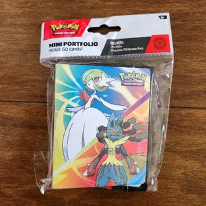 Pokemon Mega Evolution Mini Portfolio Binder w Booster Pack
