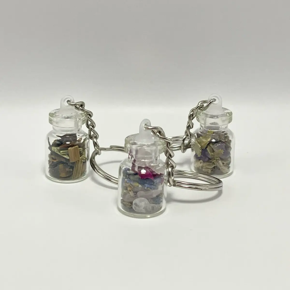 Spell Jar KeyChain - Clear Glass Jar with Decorative Stones, Herbs, Silver Chain Attachment, Keychain Design