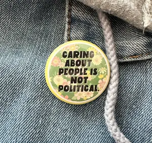 Caring About People Is Not Political Button