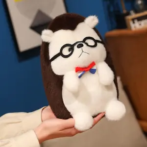 A plush hedgehog toy with glasses and a bow tie. Soft and fluffy stuffed animal. Suitable for room decoration, car interior decoration, children's birthday gift, Mother's Day gift, graduation gift, and wedding decoration.