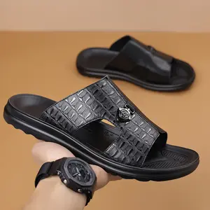 Men’s slide sandals with crocodile texture, featuring a bold embossed strap and a thick cushioned sole for all-day comfort. Easy slip-on casual design, perfect for summer fashion, beach days, and everyday errands. Available in black and brown for versatil