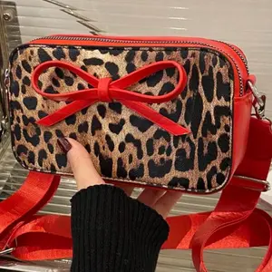 Leopard Purse with Red Bow Detail - Versatile Design for Everyday Use