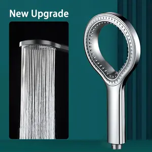 High-pressure shower head - wall-mounted and handheld round spray, featuring an ergonomic grip, durable plastic in black/silver/grey design, designed for modern bathroom upgrades, water pressure booster, modern aesthetics, and sturdy structure