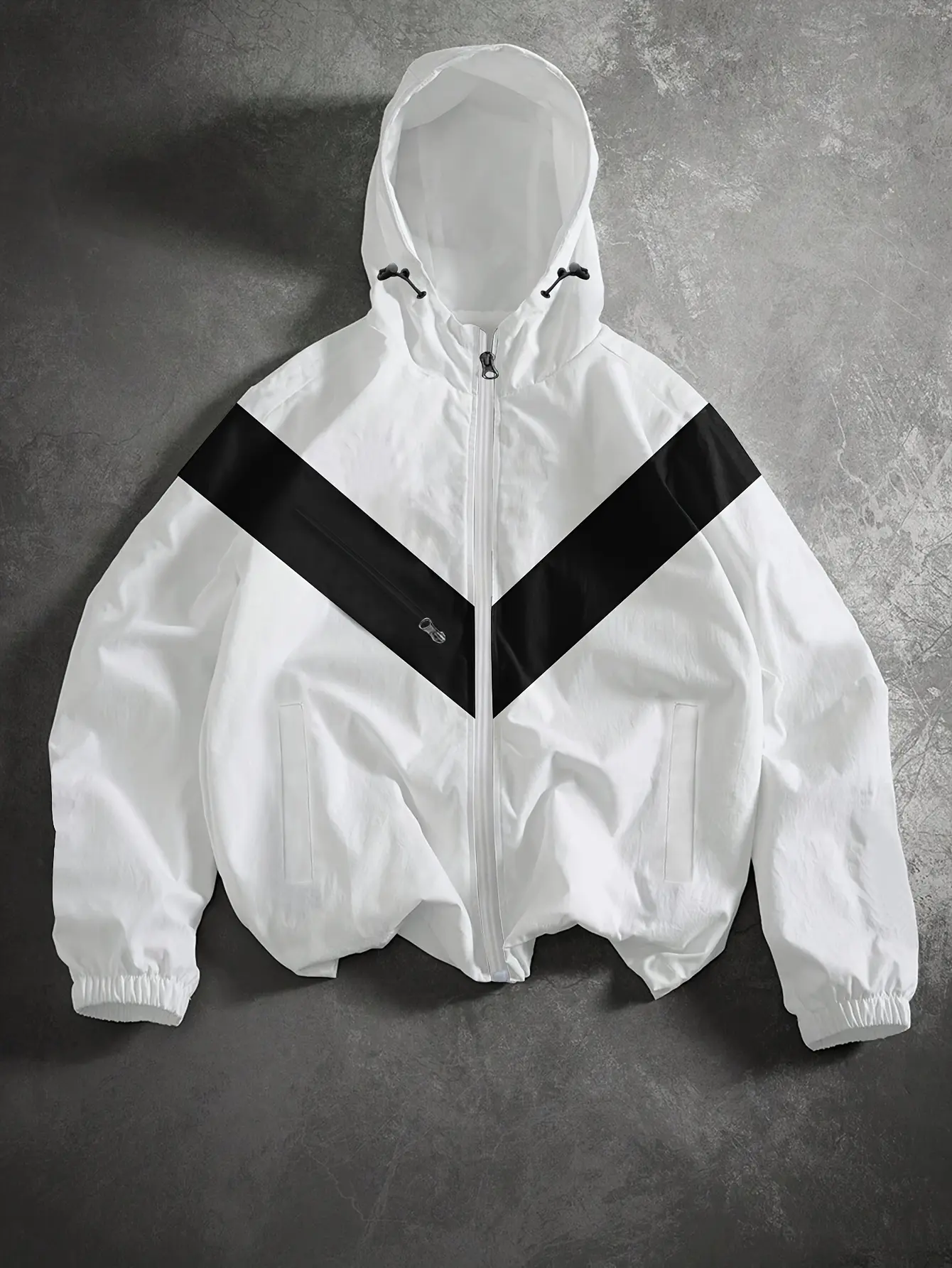 Preppy geometric color-block hooded jacket, unisex design with lightweight fabric, adjustable drawstring hood, slanted zipper chest pocket, side slip pockets, casual sporty zip-up windbreaker style.