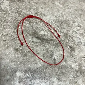 Tiny, thin and beyond minimalist red string bracelet. Daily