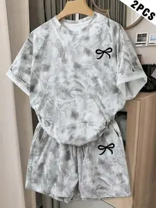 tiktokshopspringglowup "Trendy 2-Piece Camo Print Lounge Set | Short Sleeve Tee & High-Waist Shorts | Adorable Black Bow Accent | Soft Fabric, Perfect for Sleep, Lounging or Casual Outings | Women's Fashion Pajamas"