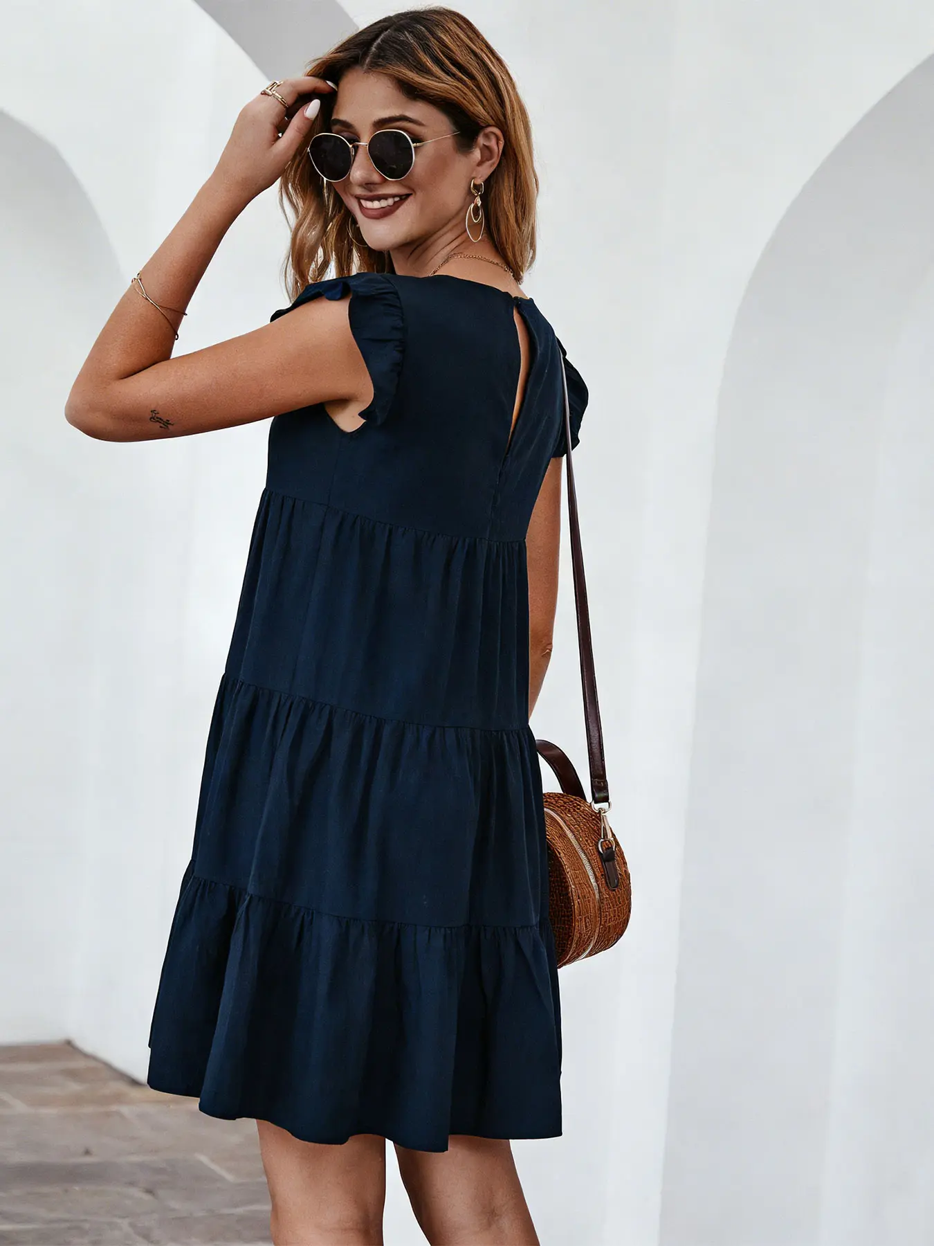 A women's solid color round neck short sleeve casual tiered dress with pleated flared hem, suitable for summer, beach vacations, other casul occasions, casual boho style, Boho flowy dress, Boho Sundresses, Womenswear
