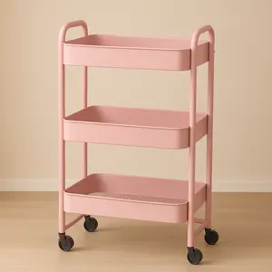 Three-tier wheeled storage cart, space-saving, suitable for kitchens, bathrooms, offices, and dormitories. Easy to assemble, available in pink and white.