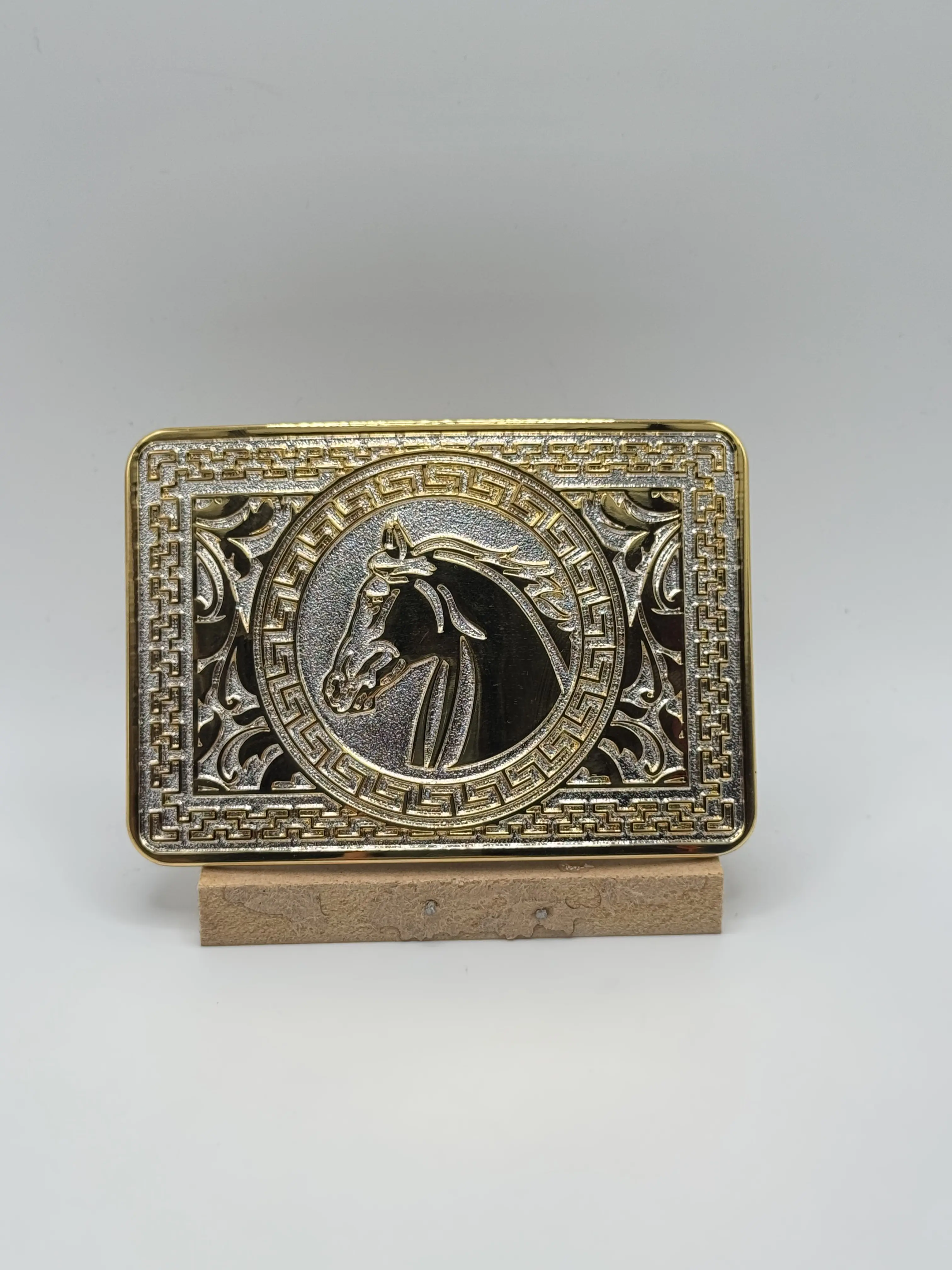 Gold horse head belt buckle