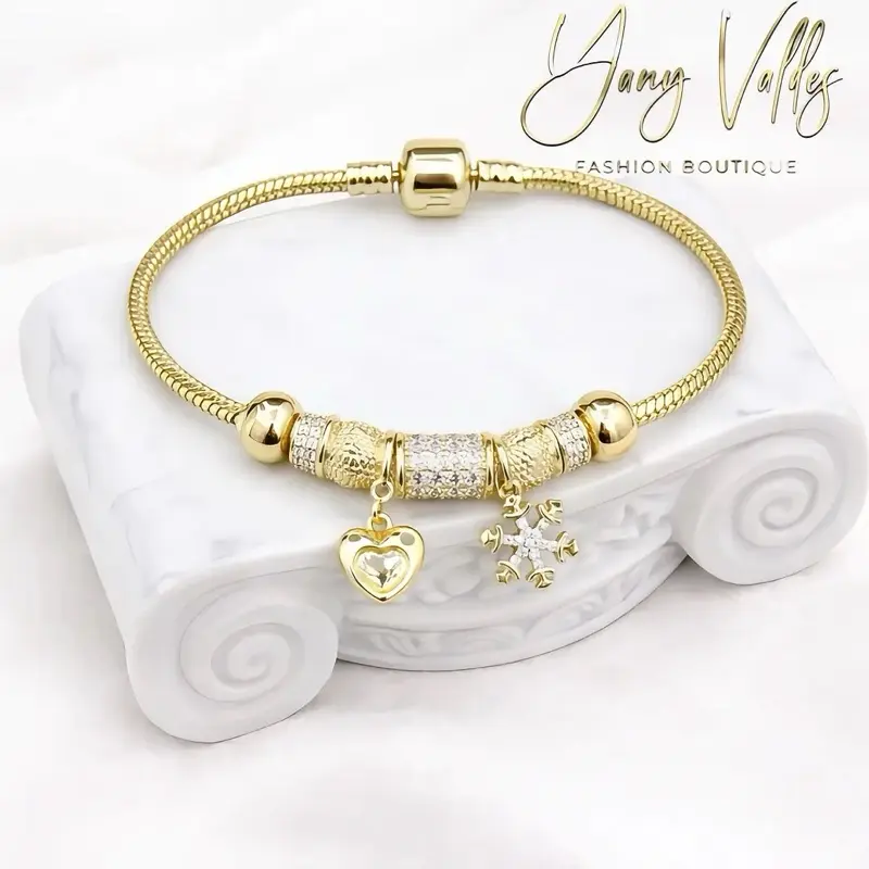 Charm bracelet with gold plated finish and for daily wear.