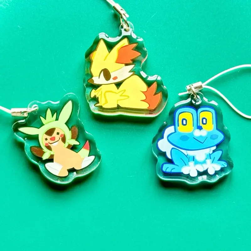 Pokémon 1.5” Acrylic Charms with Double-Sided Epoxy, Generation 6 Starter Collectible Keychains