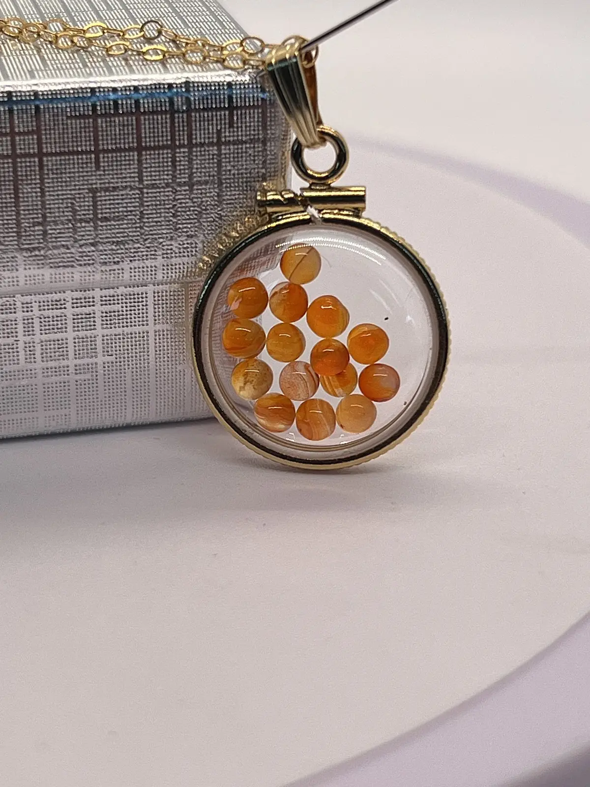 14k gold filled dime size Lucite Shaker Locket with  Carnelian cabochons