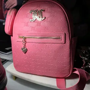 Juicy Couture Pink Backpack with Heart Charm and Gold Zipper Details