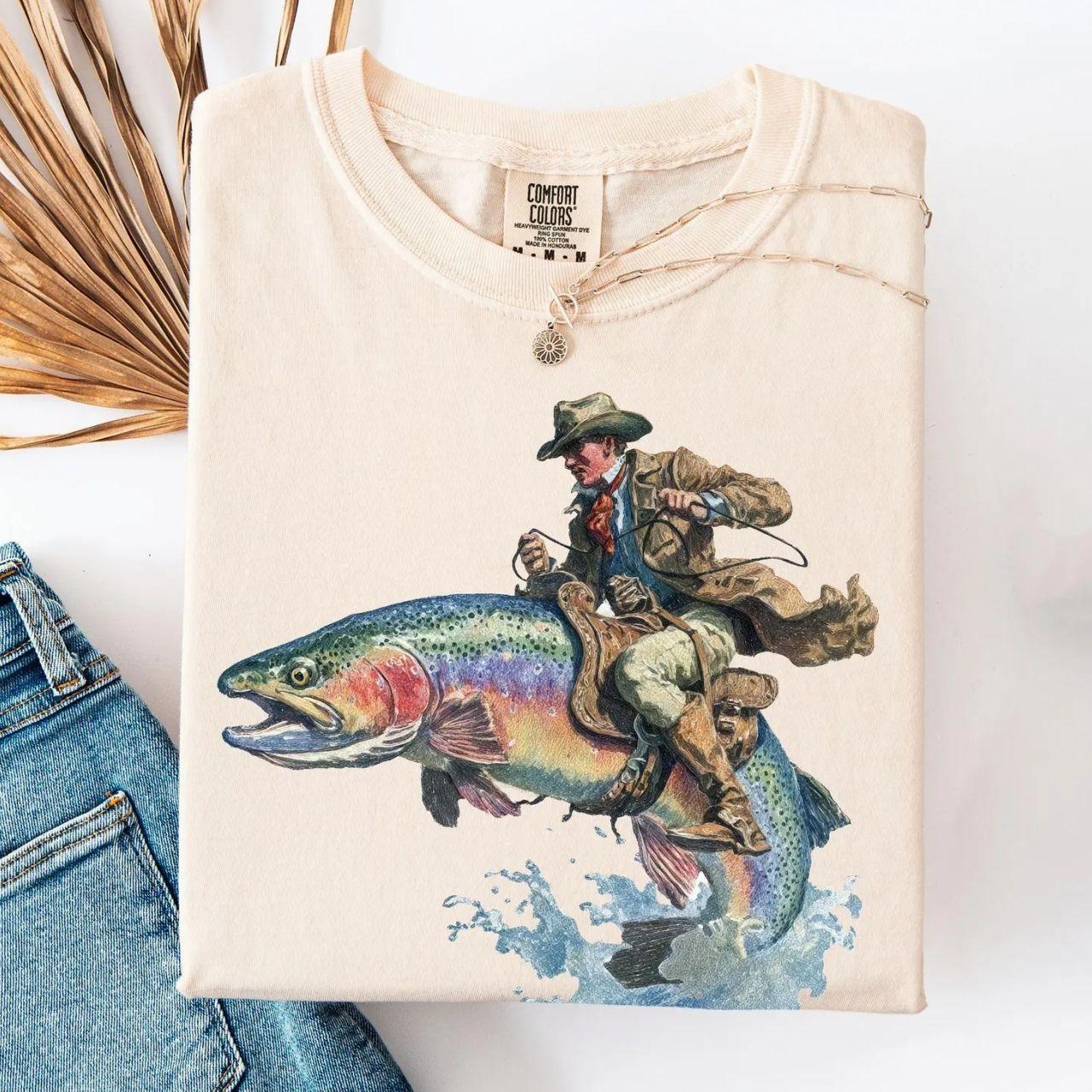 Cowboy Riding Rainbow Trout T-Shirt | Genuine Comfort Colors | Cowboy Fishing Club Rodeo Graphic Tee Unisex Womenswear Graphic Tops SPY
