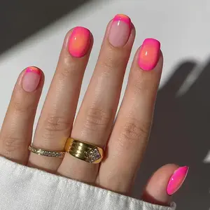 Radiant Sunset Glow – A vibrant nail art design that blends neon pink and warm orange into a flawless gradient, creating a luminous, sunset-inspired look. Perfect for making a bold fashion statement, these glossy and modern elegance in every light.