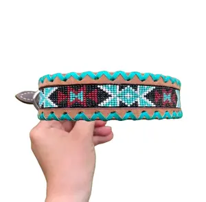 Genuine leather dog collar with teal, white, and burgundy  beaded inlay design, a rawhide wrapped edge