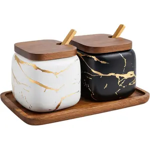 2 sets of marble ceramic sugar bowls and seasoning jars with wooden lids and wooden spoons, black and white