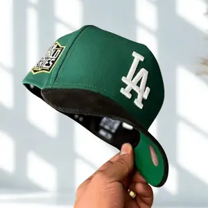 New Era 9FORTY MLB LA Dodgers Green Snapback Hat, White Embroidered Logo Baseball Cap | High Crown Flat Brim Adjustable Hat For Men & Women, Urban Streetwear Hip Hop Style, Premium Cotton Breathable Material, Limited Collector Edition