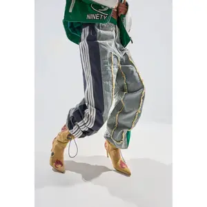 ALL AROUND THE WORLD PATCHWORK DENIM JOGGER PANT IN GREEN MULTI