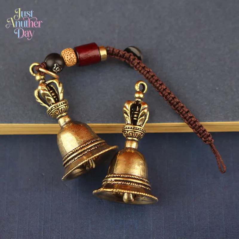 Retro Pure Brass Dorje Bell Pendant, Vintage-Style Small Bell Charm with Woven Cord, Keychain for Camping & Hiking Gear, Intricate Traditional Design for Spiritual Decor