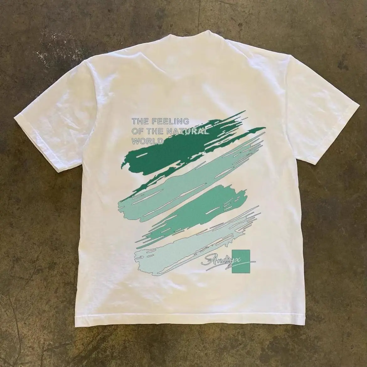 Green Watercolor Graffiti Letter Graphic T-Shirt | Unisex 100% Cotton Tee | Soft & Comfortable Casual Short Sleeve Shirt | Trendy Streetwear Fashion Top