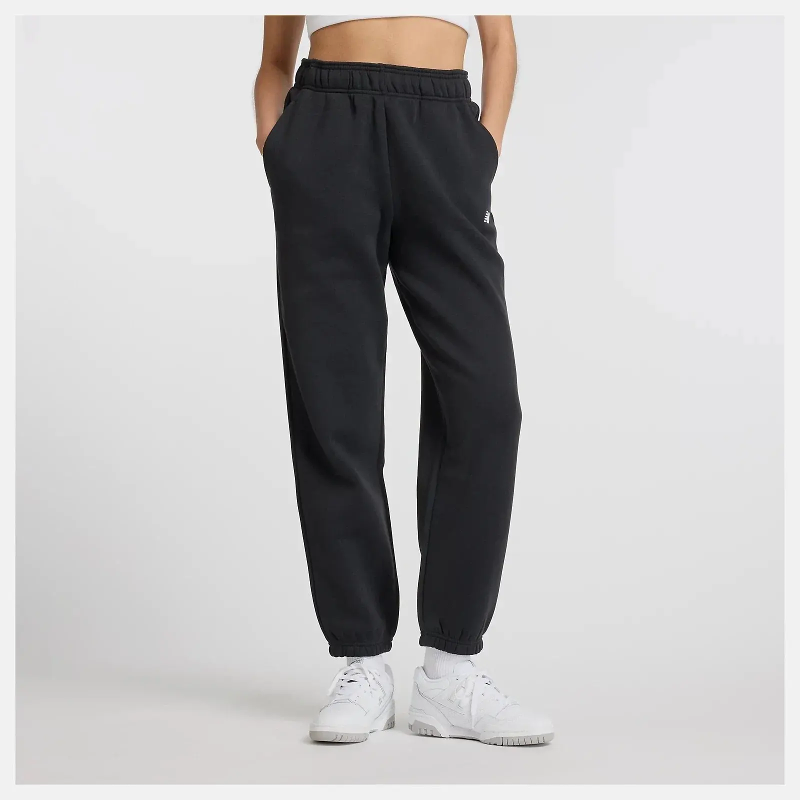 New Balance Sport Essentials Joggers Tapered Leg Pants in Black Fleece | Women's