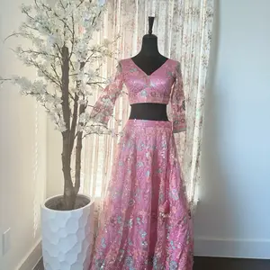 Lehenga Choli - Pink Floral Design Dress on Mannequin Display with Decorative Plant and Curtains