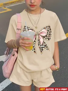 Casual Knit Short Sleeve Set with Printed Design, Loose Top and Pocketed Shorts for Spring and Summer, Women's Festive Promotions