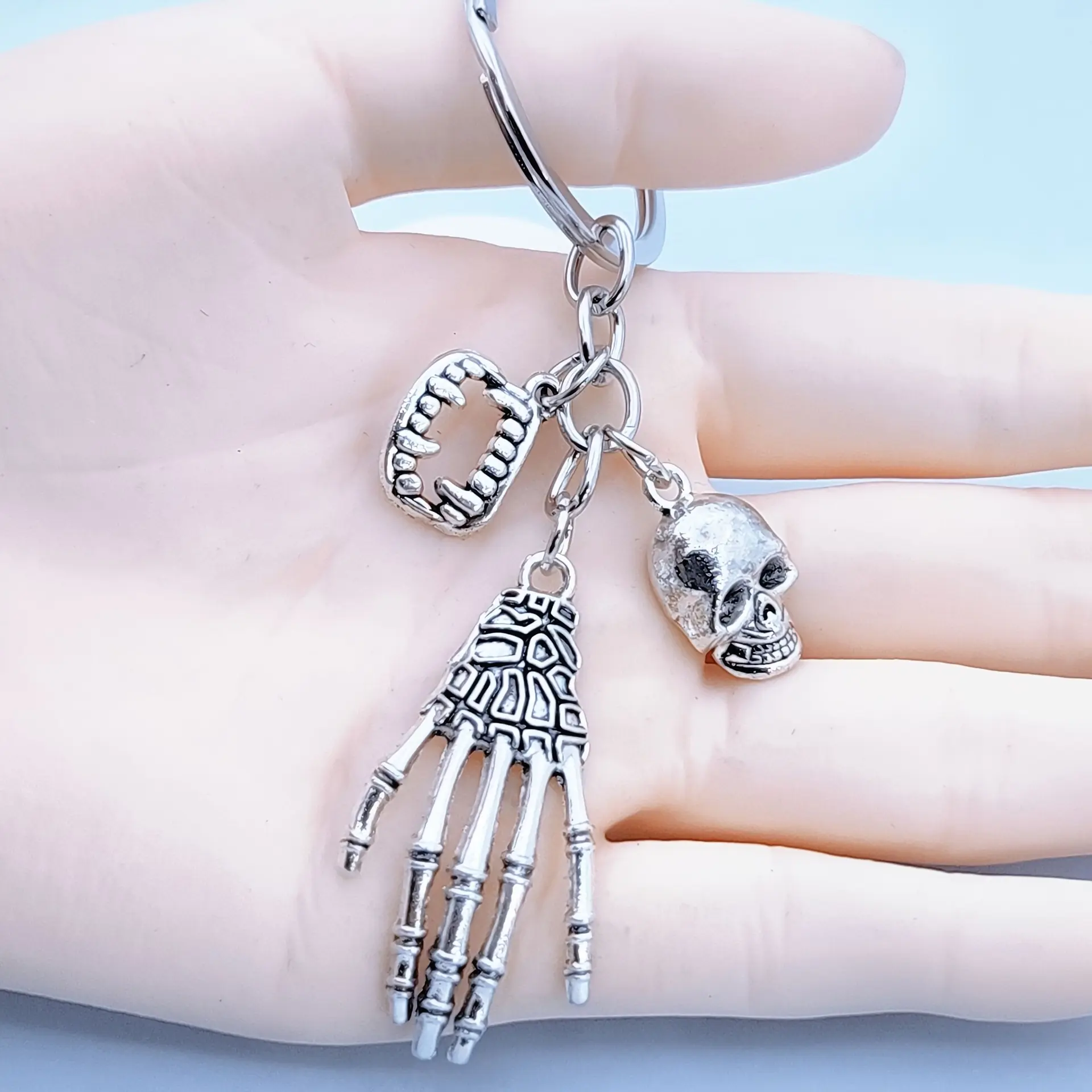 Spooky Skeleton Hand and Skull Keychain - Durable zinc alloy, Gothic style backpack charm, exquisite design, perfect for Halloween and everyday use