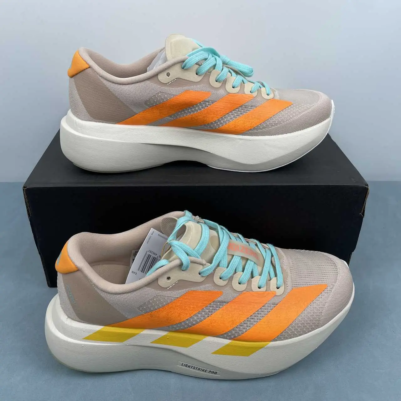 Performance running kicks with lightweight thick‑cushioned build, breathable engineered mesh in beige with orange‑cyan accents, must‑have sport footwear for jogging and daily fitness training