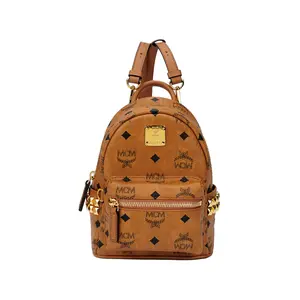 MCM Monogram Rivet-Trimmed Coated Canvas and Leather Mini Backpack for Men and Women in Brown Cognac