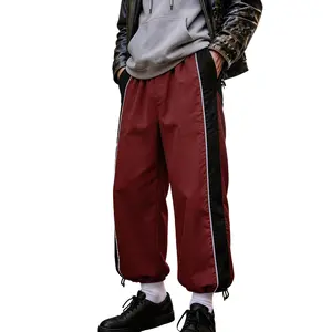 Men’s retro jogger pants with side stripes, loose wide-leg fit, high-street style long pants quick dry tech training short