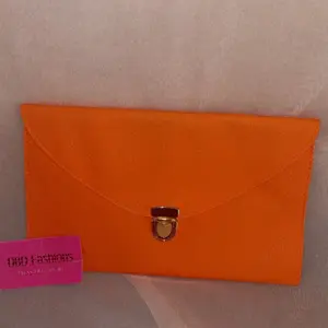 Orange envelope clutch w detachable chain